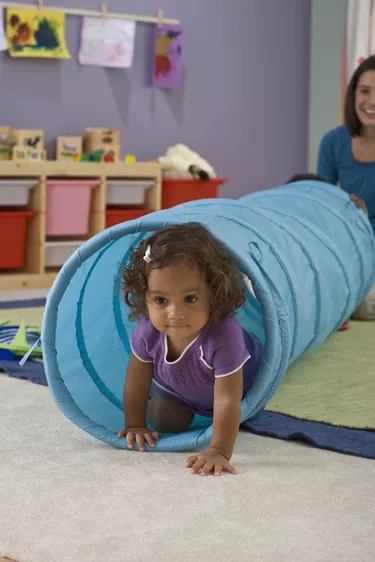 daycare worker with child