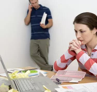 Concerned couple with paperwork