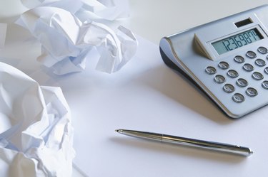 Crumpled paper and calculator