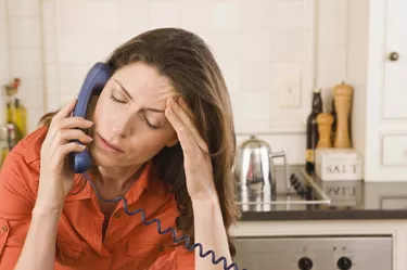 Distressed woman on telephone