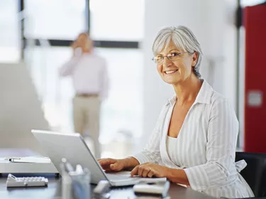 portrait of a mature woman using a laptop