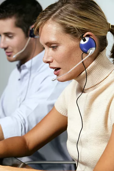 Customer service representatives with headsets