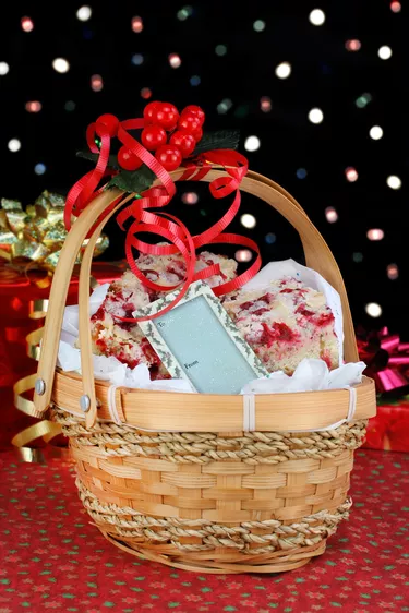 Christmas basket of cranberry bar cookies in front of colorful b