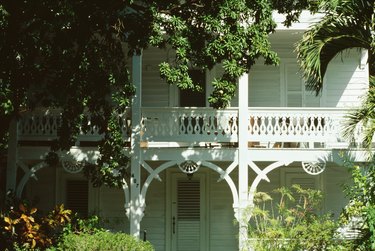 Exterior of old-fashioned home with foliage, Florida