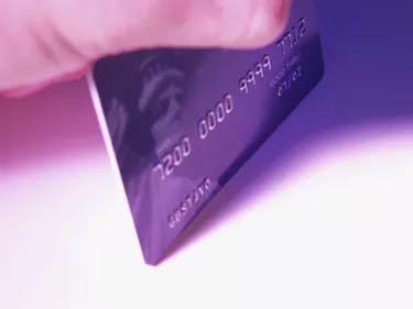 Close-up of hand holding a credit card