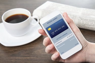 businesswoman hand holding a phone with mobile wallet online shopping