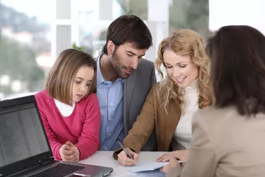 Couple and child buying house