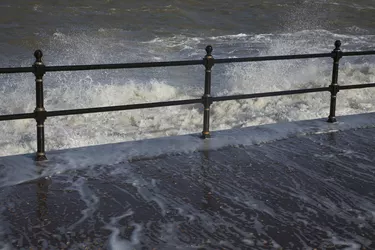 Water crashing over rail