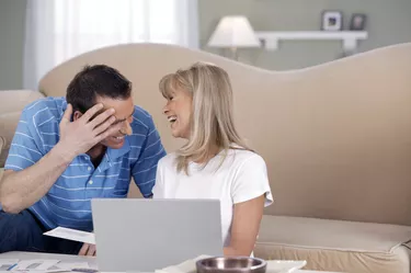 Couple paying bills online