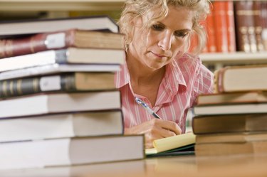 Woman with books in library