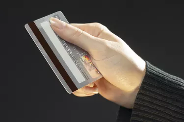 Woman holding a credit card