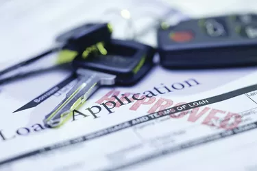 Approved loan application with car keys