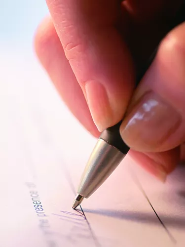 Photo, woman's hand signing a document, close-up, Color, High res