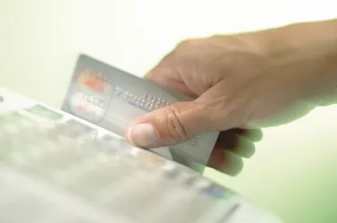 Person sliding credit card