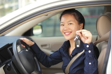 woman driver happy with her first car