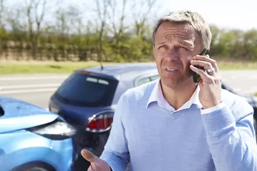 Driver Making Phone Call After Traffic Accident