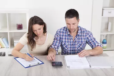 Couple Calculating Bills