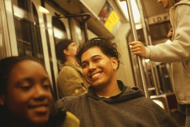 Group of teenagers (16-17) on underground train