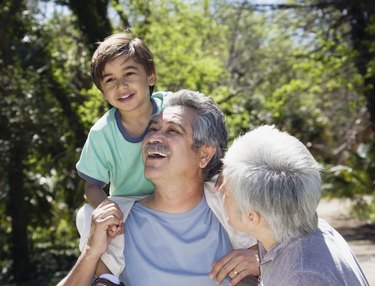 Hispanic grandparents with grandson outdoors