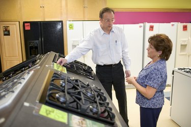 Salesman with woman in appliance store