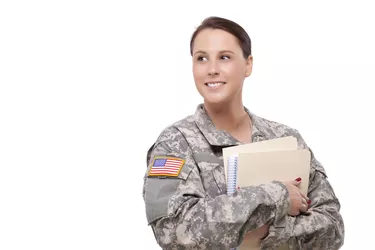 Female soldier with folder looking away