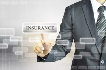 Businessman touching INSURANCE sign