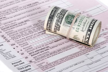 United States cash near an IRS tax form