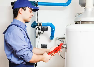 Technician repairing an hot-water heater