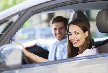 Young couple sitting in car