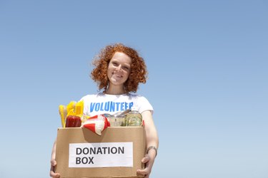 volunteer with donation box