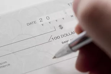 Business woman prepare writing a check