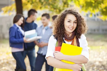 Cheerful young student smiling