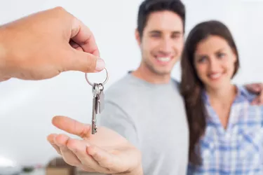 Man being given a house key