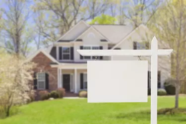 Blank Real Estate Sign in Front of New House