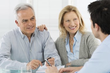 Senior Couple Talking With A Consultant