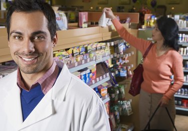 Pacific Islander pharmacist in front of customer