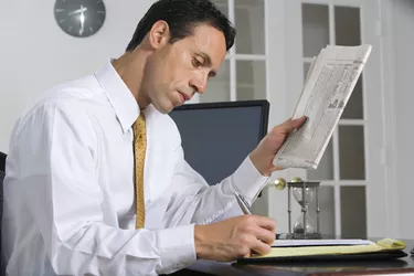 Businessman with newspaper