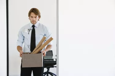 Businessman with box of supplies