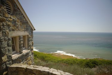 Side profile of a stone cottage on a waterfront, Pacific Ocean, San Diego, California, USA