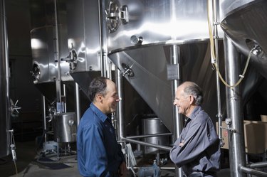 Co-workers talking in a brewery
