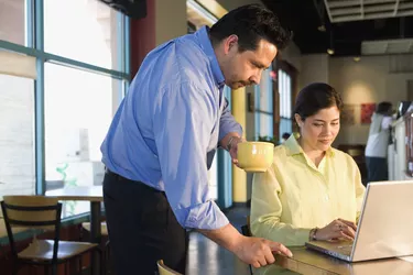 Multi-ethnic businesspeople working at cafe