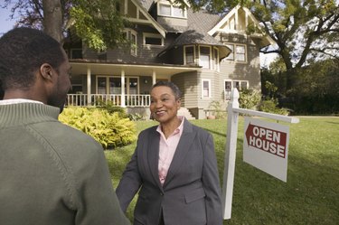 Man shaking real estate agent's hand