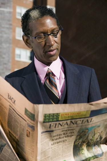 Businessman with newspaper