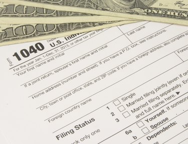 IRS Tax Form 1040 with Money