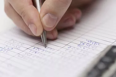 close up of businessman with papers and calculator