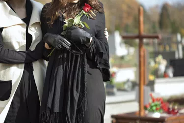 Mother and daughter at cemetery