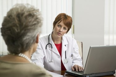 Doctor with patient in office