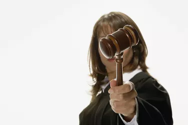 Studio shot of African female judge holding gavel