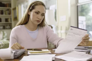 Woman reading a sheet of paper