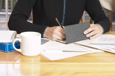 Woman writing a check